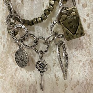 Charms galore are adorning this quaint long multi layered necklace. A must have